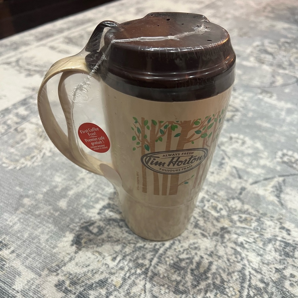 New-in-packaging vintage Tim Hortons travel mug